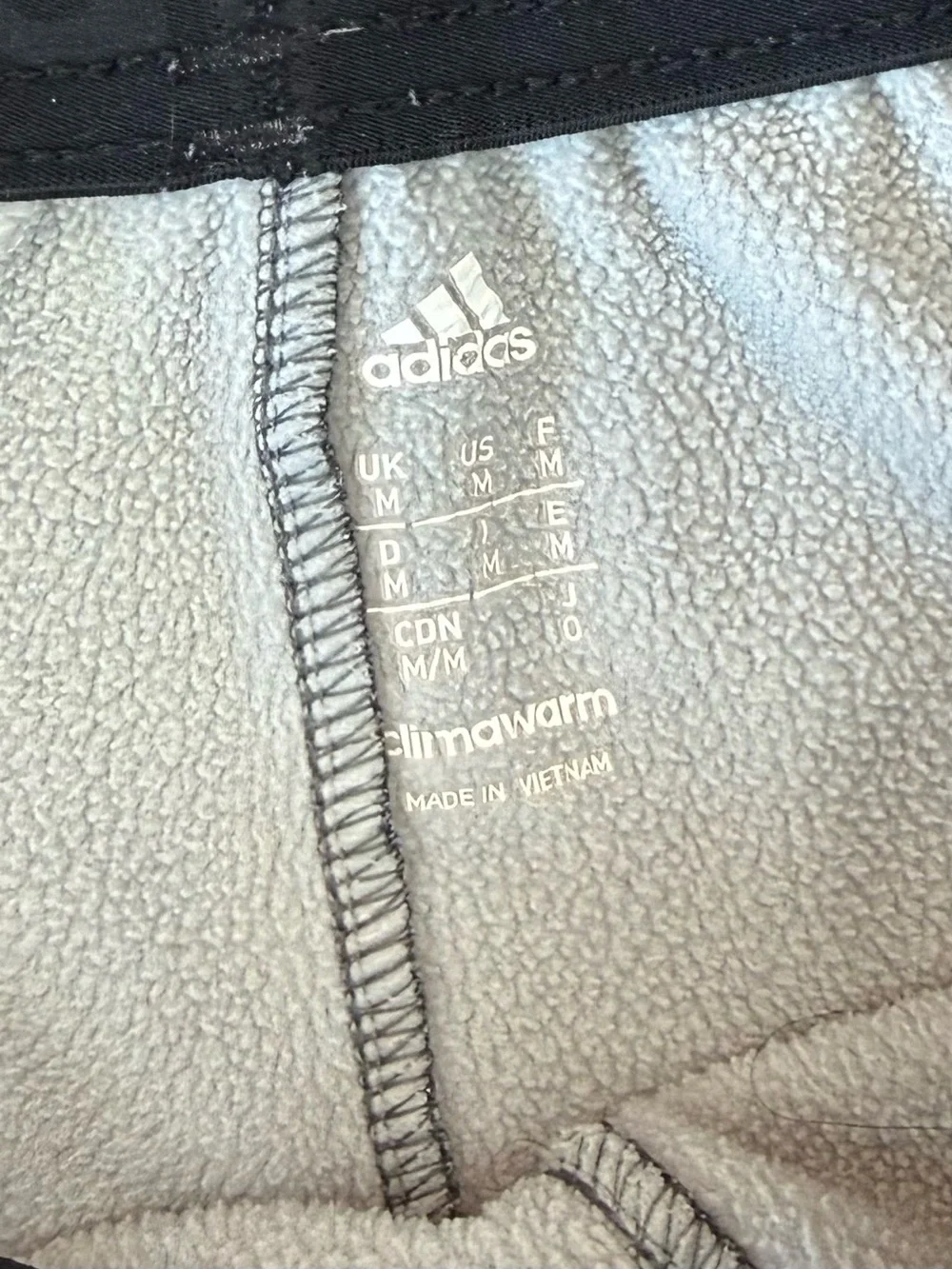 adidas Grey Climawarm Joggers With Fleece Lining And Pockets.